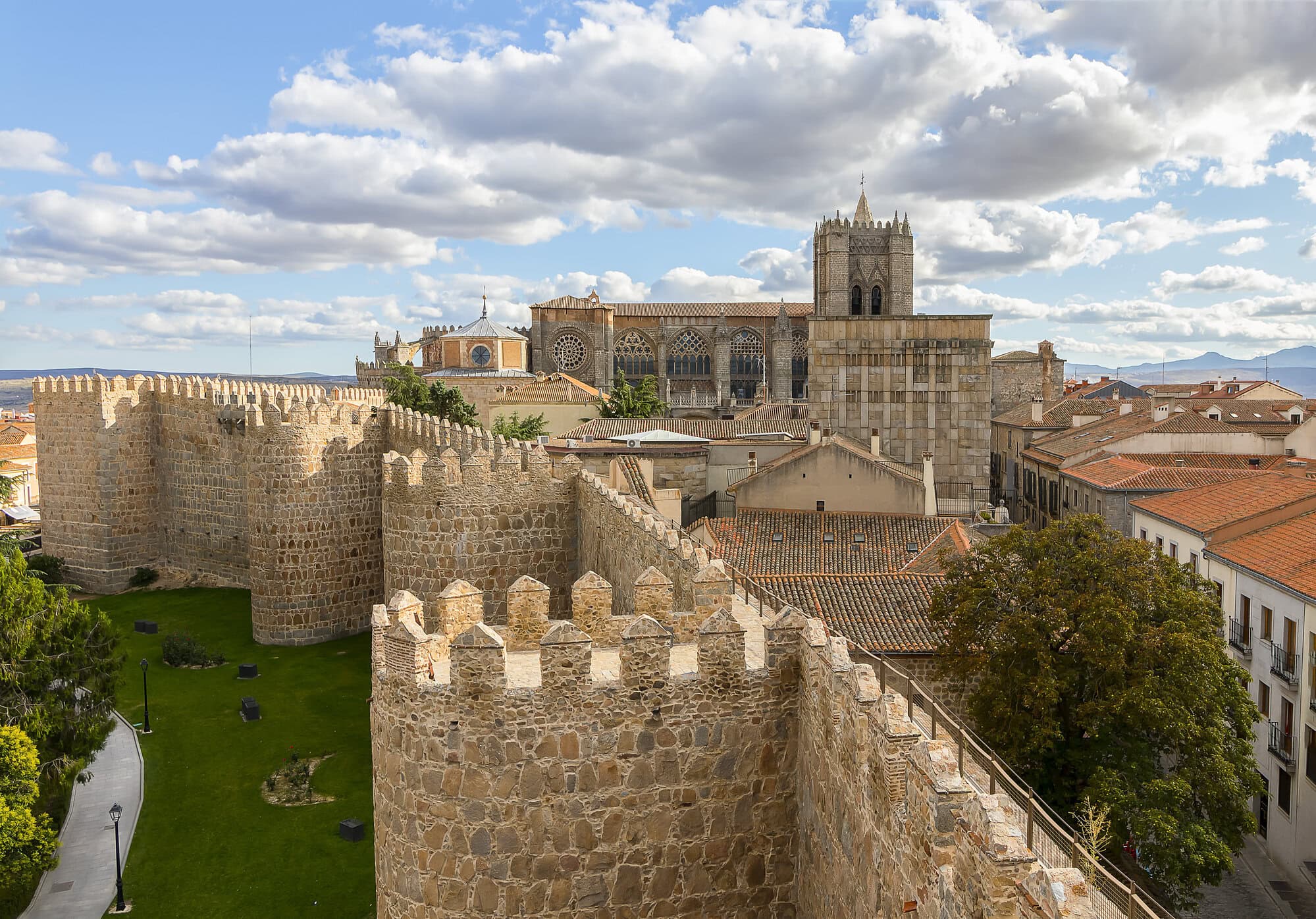 View of Avila Cathedral from Walls of Medieval city of Avila, Castile and León, Spain. This city was declared a UNESCO World Heritage Site in 1985.