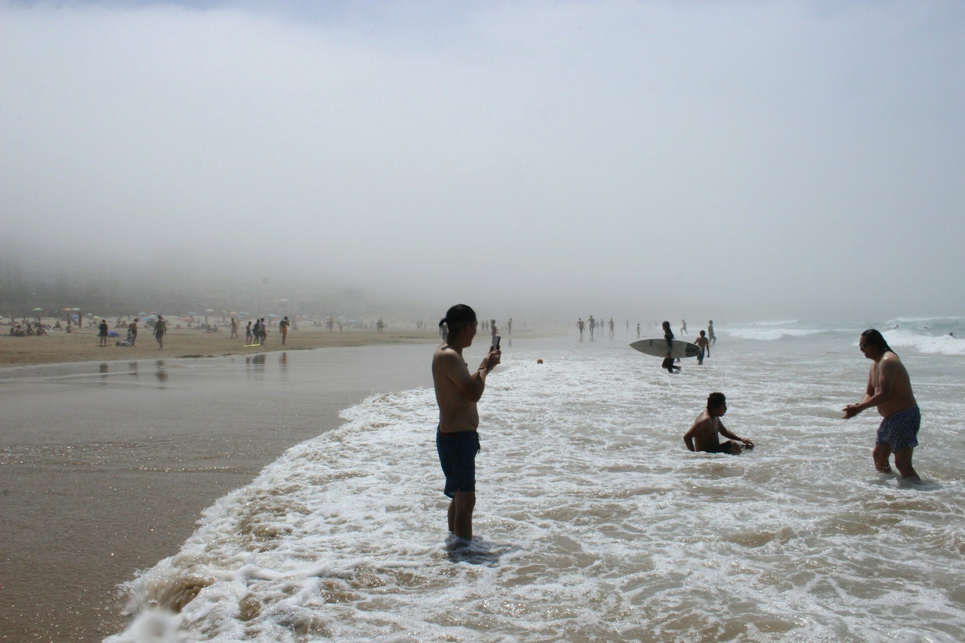 San-Sebastián-Spain-Zurriola-Surfer-beach-fog
